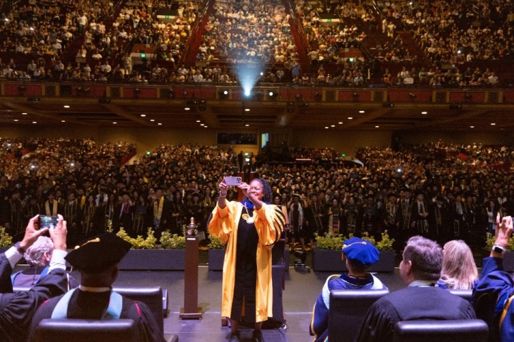 President Berenecea Johnson Eanes takes a selfie with the graduating class during the 2025 Cal State LA commencement ceremony.